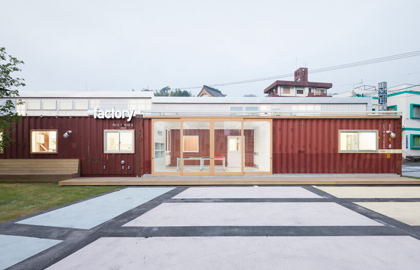 second-hand red shipping containers form 'kotobuki' cheese factory by micelle in japan