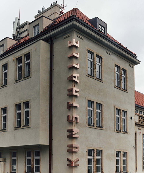 bent bronze letters embrace the corner of kunsthalle praha building