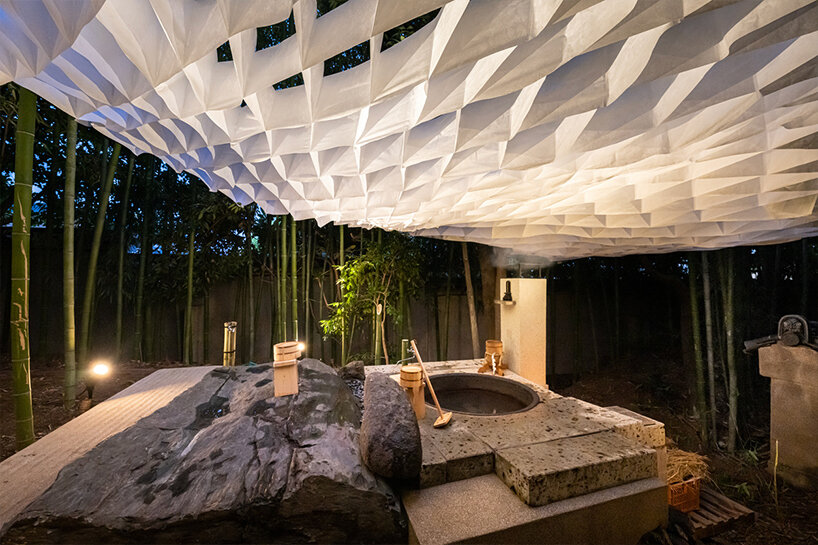 kengo kuma's interwoven pavilion hovers among bamboo grove in tokyo