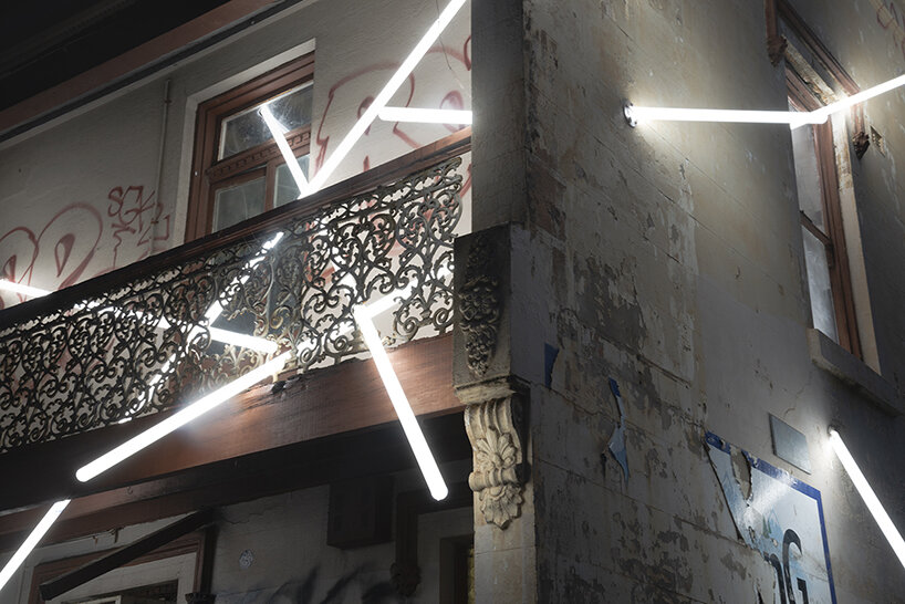 beams of light pierce through this 19th-century derelict building in sydney, australia