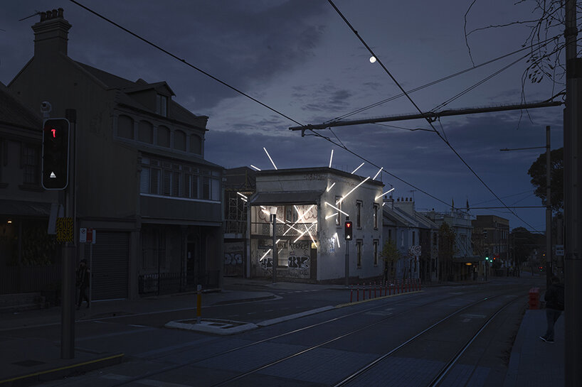 beams of light pierce through this 19th-century derelict building in sydney, australia