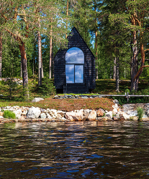 pirinen & salo clad the filmmakers hut in finland with tar-coated shingles