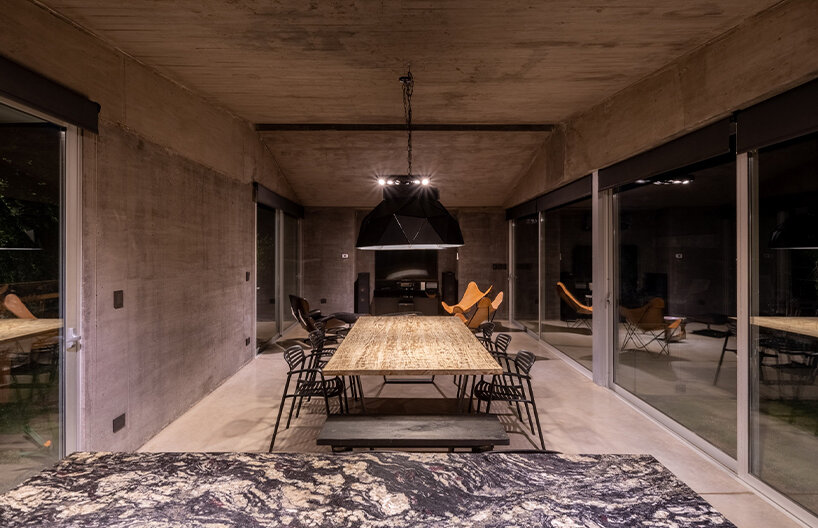 a thin ray of light permanently pierces through this argentinian house