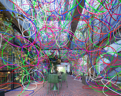 kengo kito fills sou fujimoto-designed shiroiya hotel with 2,500 illuminated festive hula hoops