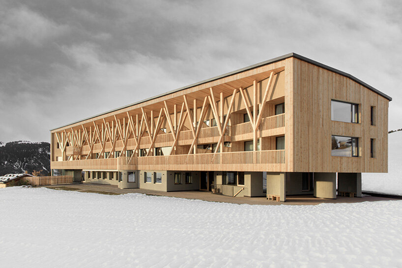 MoDusArchitects unveils its icaro hotel, a forest of timber columns in the dolomites
