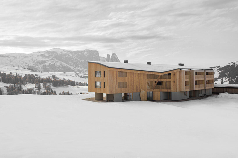 MoDusArchitects unveils its icaro hotel, a forest of wooden columns in the dolomites