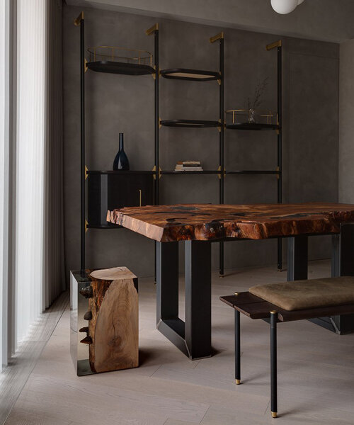 this hong kong apartment features a wooden table made from a 1000 year old kauri log