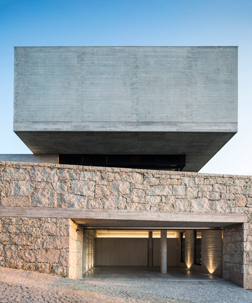 AZO arquitectos stacks volumes of stone and glass to build its casa em nogueiró