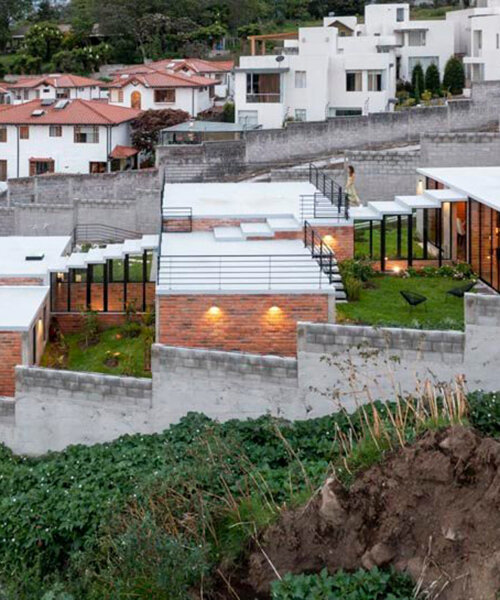 three interconnected staggered blocks shape house on slope in ecuador
