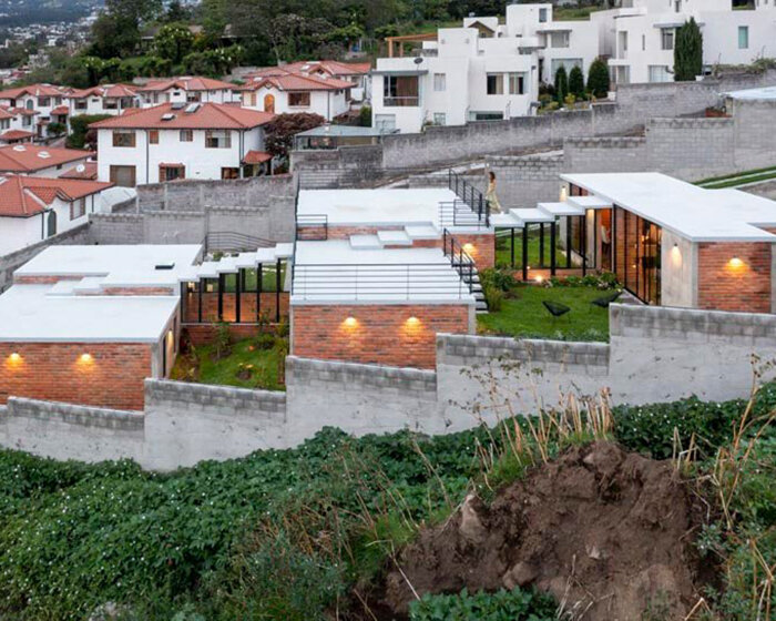 three interconnected staggered blocks shape house on slope in ecuador