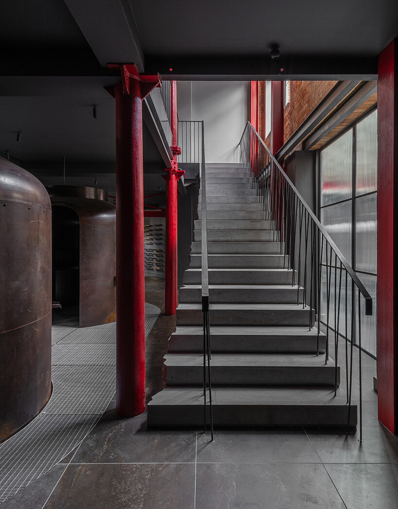 chimneys, boilers and brightly colored resin panels complete london showroom by holloway li