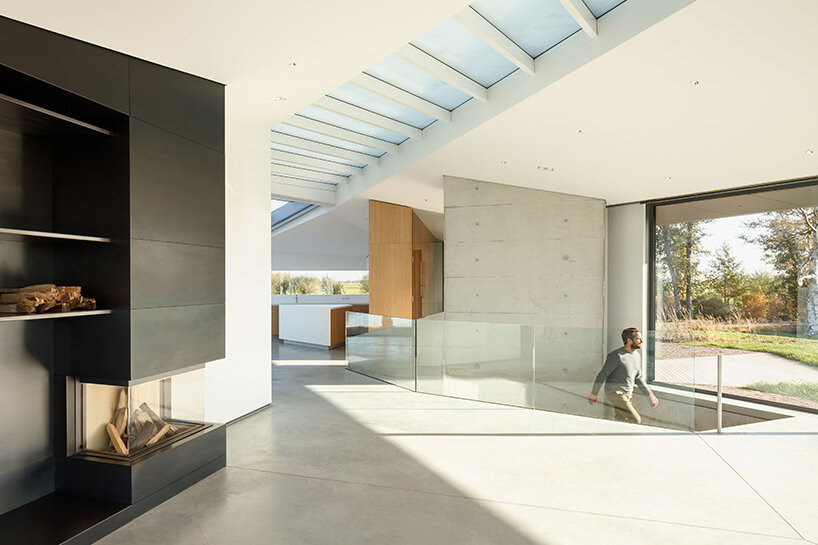 rural house that prioritizes natural lighting settles amid polder landscape in the netherlands