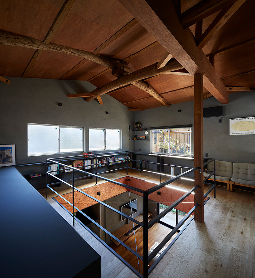 a double height void cuts through this house in japan