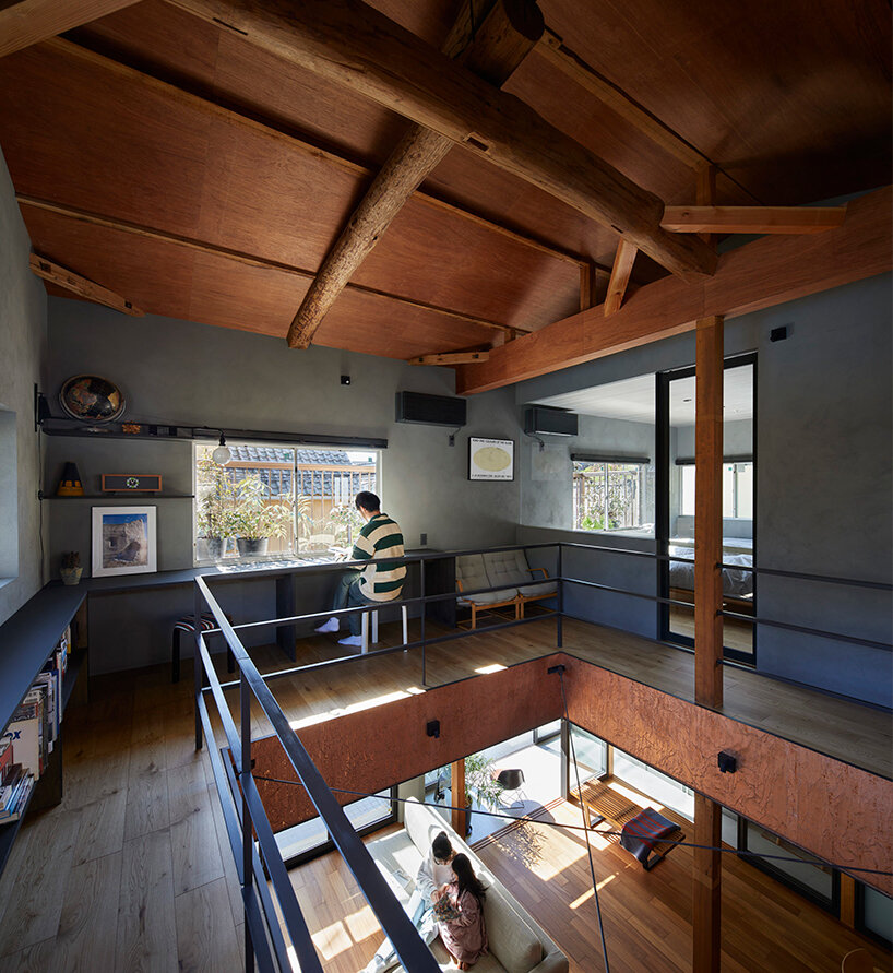 a double height void cuts through this house in japan