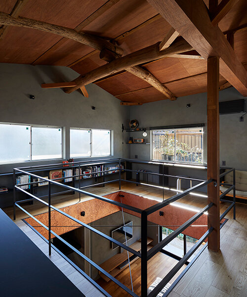 a double height void cuts through this house in japan