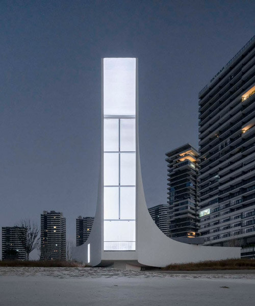 this chapel by o-office emerges as a floating pillar of light over jinting bay