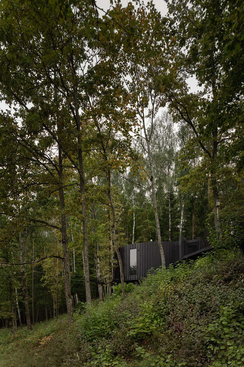 open AD adds wooden sauna with wool-clad interiors to wellness resort in latvia