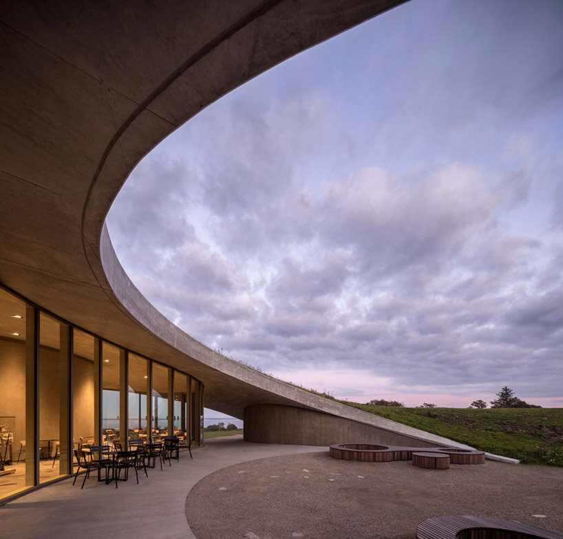 CEBRA embeds its skamlingsbanken center into denmark's rolling, hilly meadows