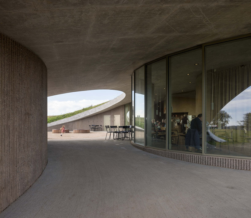 CEBRA embeds its skamlingsbanken center into denmark's rolling, hilly meadows