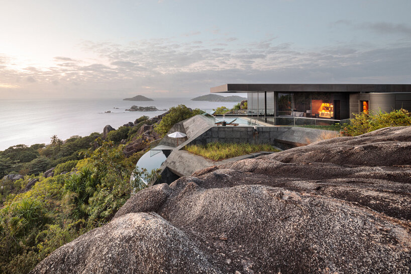 four angular holiday homes nestle into granite outcrops in the seychelles