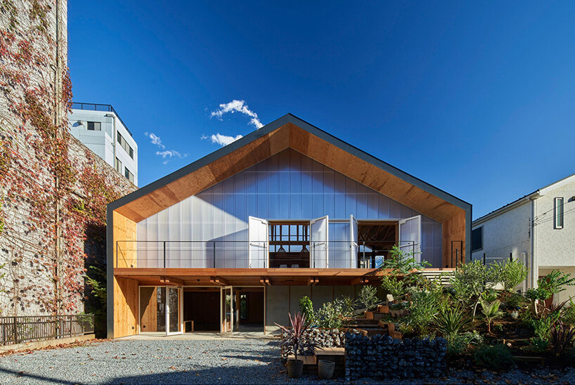 this wooden dwelling filters light through its translucent façade