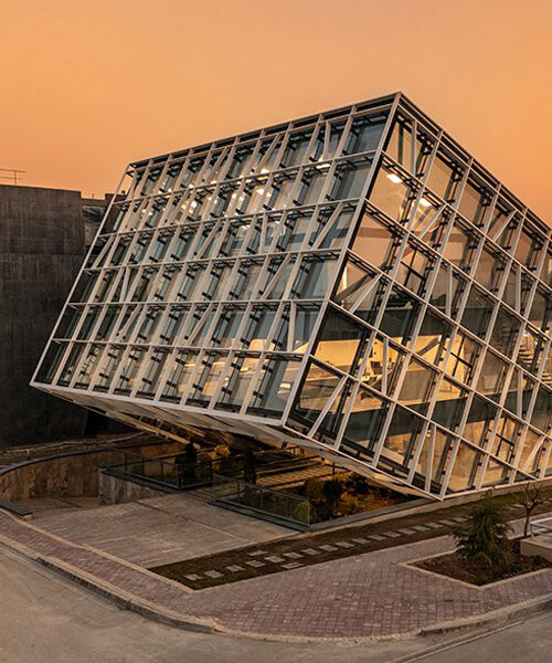 this new office and incubator building in tehran rises dramatically from the ground