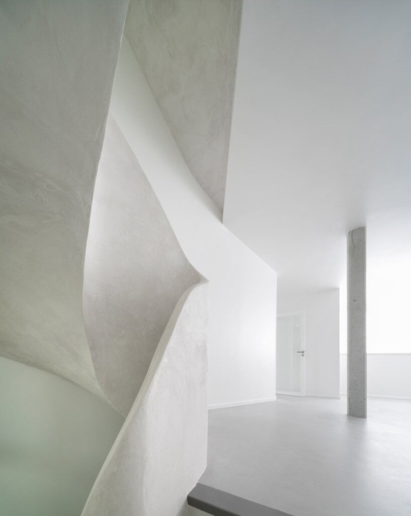 avignon architecte builds mysterious 'twist' house with sculptural ribbon staircase in nantes, france