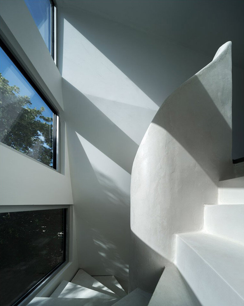 avignon architecte builds mysterious 'twist' house with sculptural ribbon staircase in nantes, france