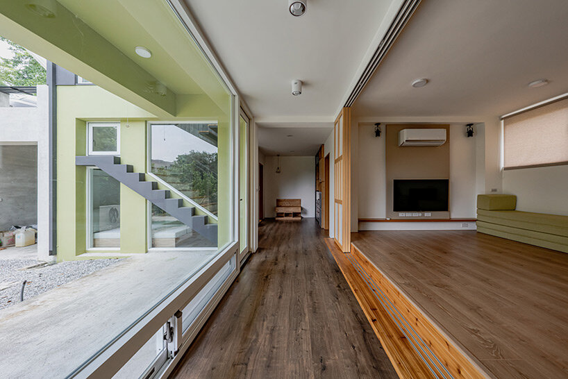 four continuous gable roofs top extroverted residence by emerge architects in taiwan