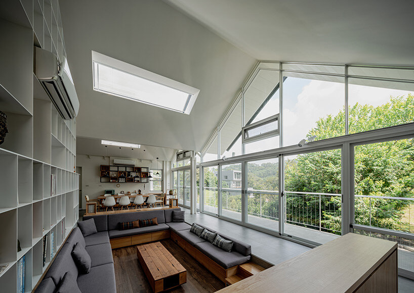 four continuous gable roofs top extroverted residence by emerge architects in taiwan