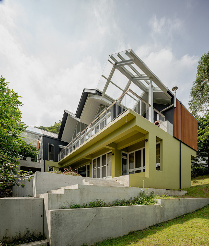 four continuous gable roofs top extroverted residence by emerge architects in taiwan