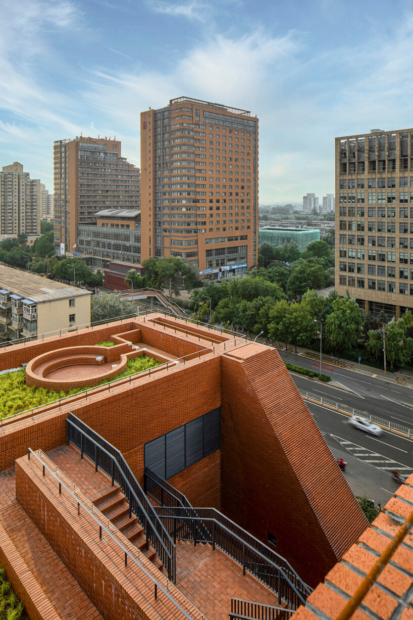 URBANUS adds a brick curtain wall and roof garden to beijing office building