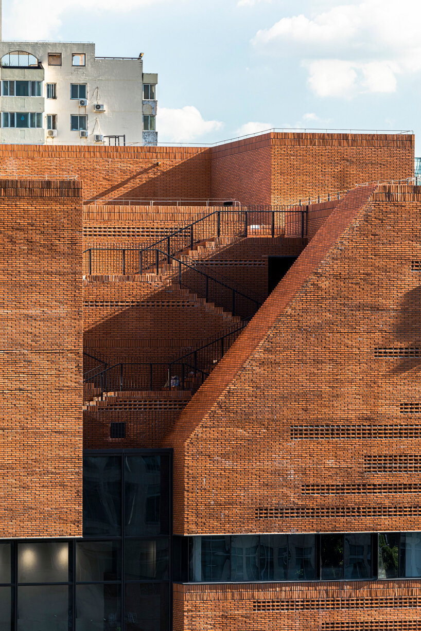URBANUS adds a brick curtain wall and roof garden to beijing office building