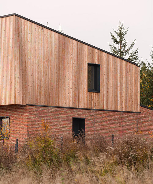 warm-toned wood and brick façades complete family home in poland by studio GAB