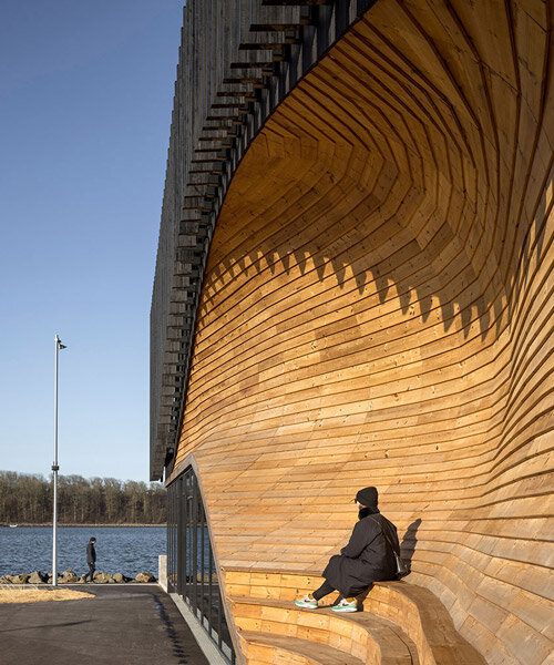 3XN honors denmark's ship-building heritage with the fluid facade of its 'klimatorium'