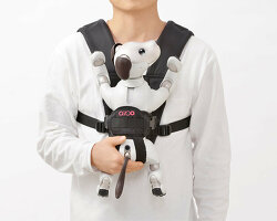 sony’s puppy robot can now be carried with its new sling that resembles a baby carrier
