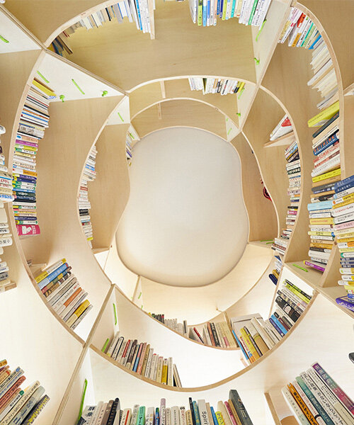 'curiosity go round': a bookcase to wander around and in, explore and interact