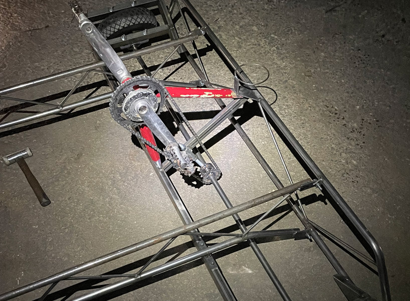 a bike inside a tunnel: artist fernando abellanas pedals through a sewer with ‘enlace’