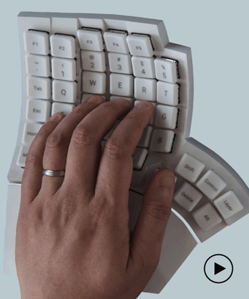 split ergonomic keyboard supports natural finger and thumb movement