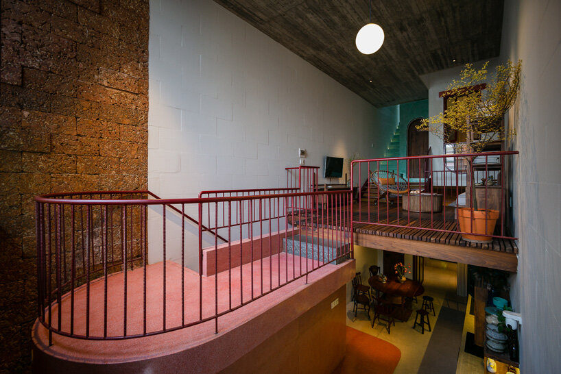 revolving wooden shutters clad the facade of AD9 architects' H house in vietnam