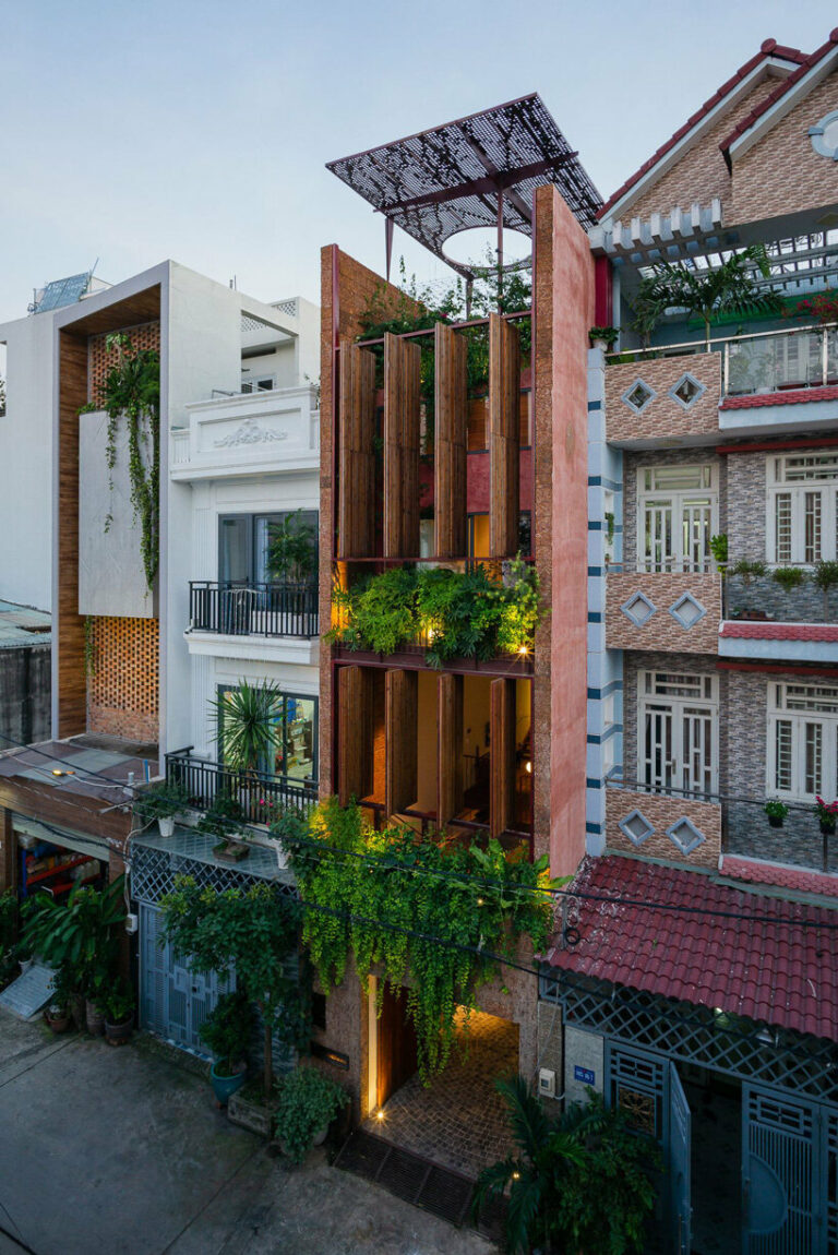 wooden revolving shutters clad the facade of AD9 architects' H house in ...