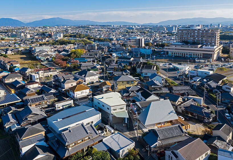 hamada design tops japanese house with rhombus-patterned galvalume roof