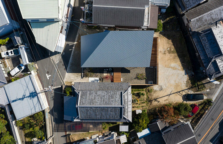 hamada design tops japanese house with rhombus-patterned galvalume roof