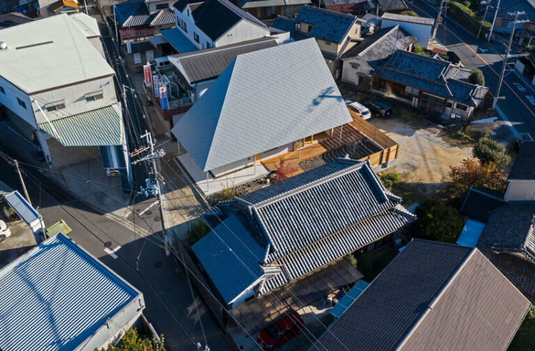 hamada design tops japanese house with rhombus-patterned galvalume roof