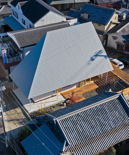 hamada design tops japanese house with rhombus-patterned galvalume roof
