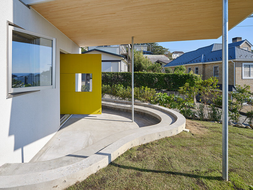 a pile of overlapping white volumes forms sunlit residence by shogo onodera in japan