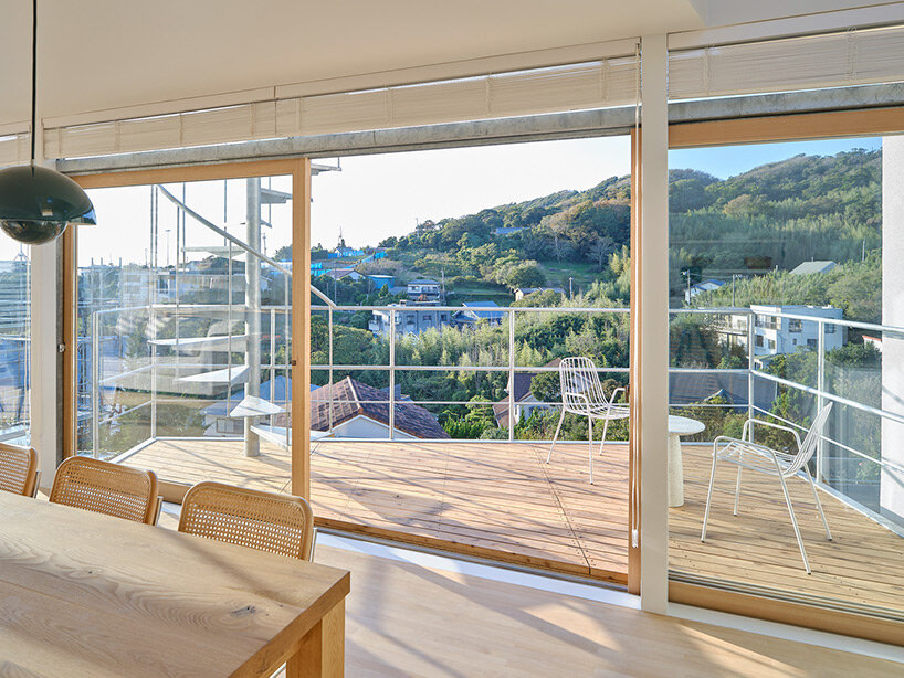 a pile of overlapping white volumes forms sunlit residence by shogo onodera in japan