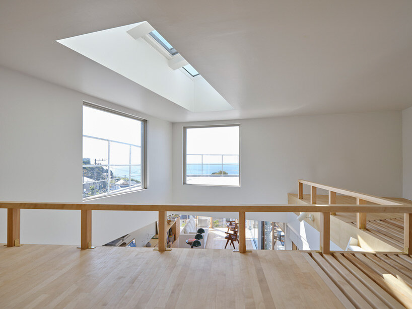 a pile of overlapping white volumes forms sunlit residence by shogo onodera in japan