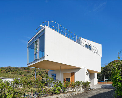 a pile of overlapping white volumes forms sunlit residence by shogo onodera in japan