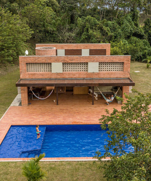 plan:b arquitectos nestles a warm brick country house in la siria, colombia